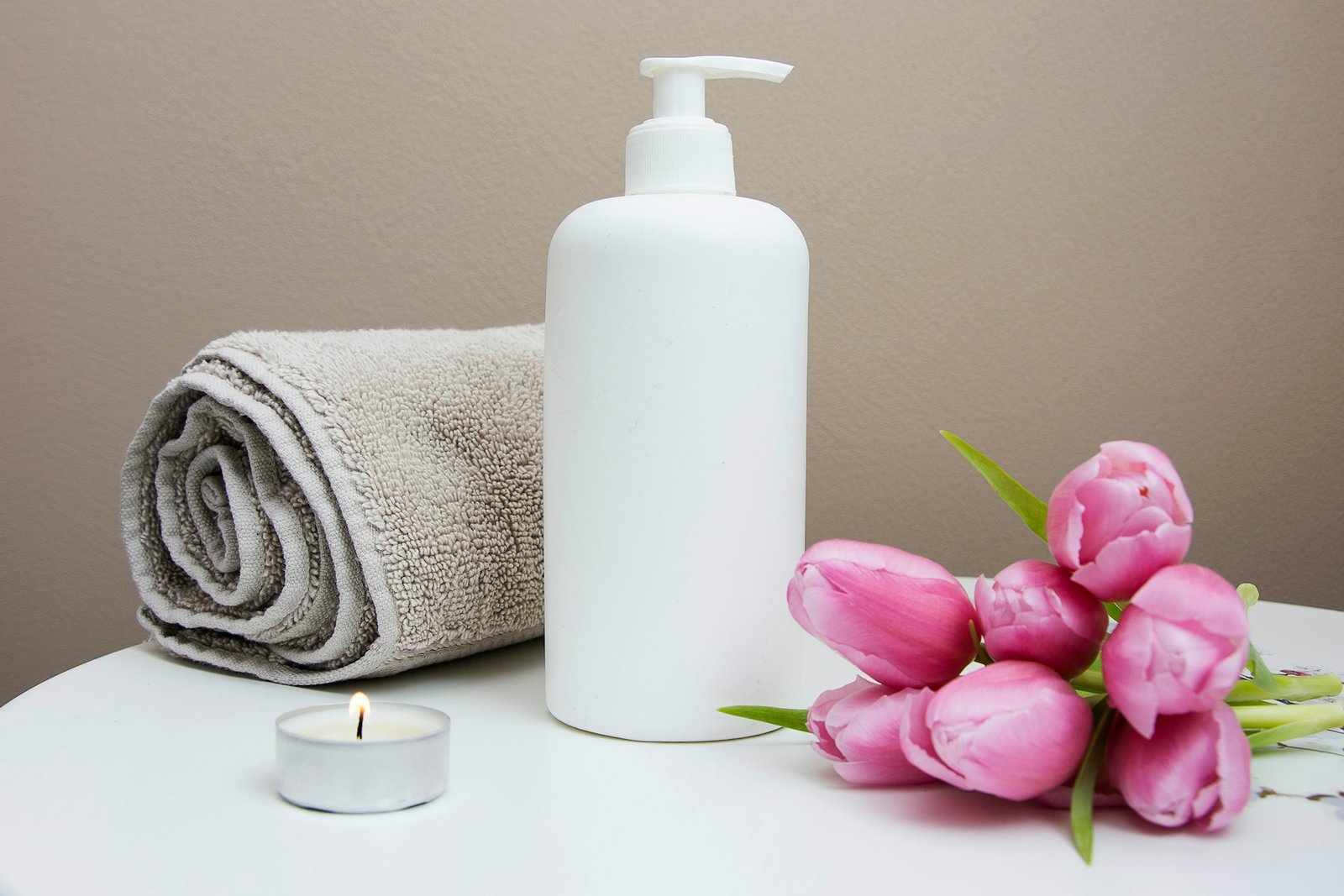 Calm, relaxing massage studio with warm low lighting and plush massage table